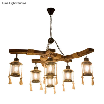 Rustic wooden chandelier with five lantern style lights clear glass brass frames and beige rope tassels for led incandescent use
