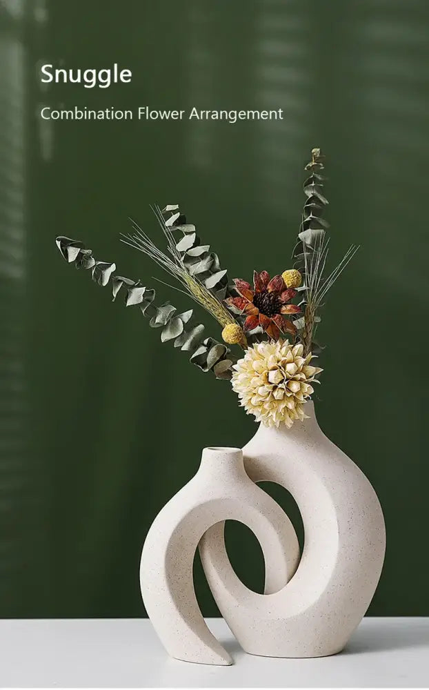 Cream-colored large 21cm decorbites™ ceramic vase with sculptural design holding dried flower arrangement for home decor
