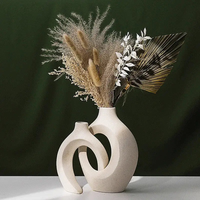 Cream-colored DecorBites™ large 21cm ceramic vase with modern abstract interlocking curved forms for home decor