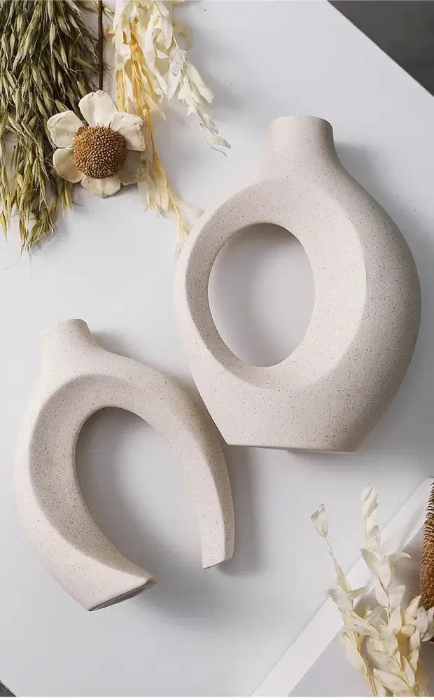 Cream-colored ceramic vase with speckled texture and abstract shapes large 21cm decorbites home decor