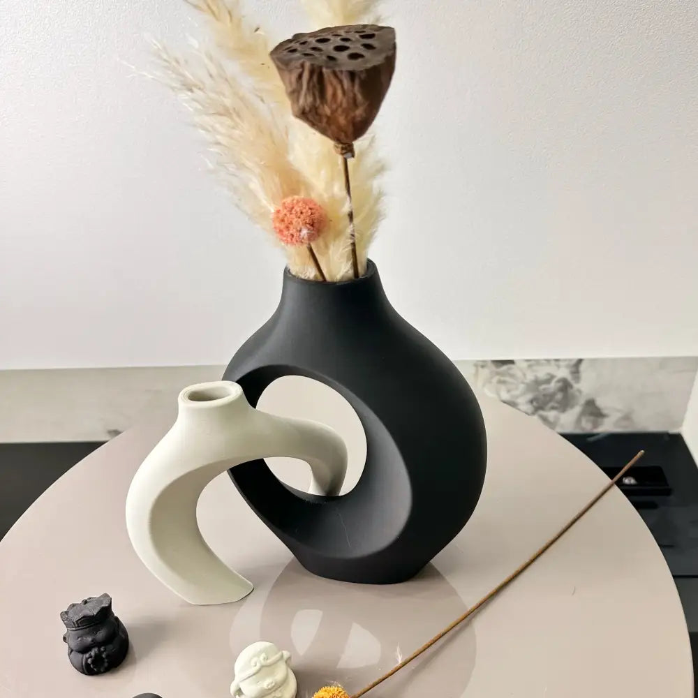 Decorbites large black ceramic dried vase with sleek modern abstract design and open circular cutout for home and office