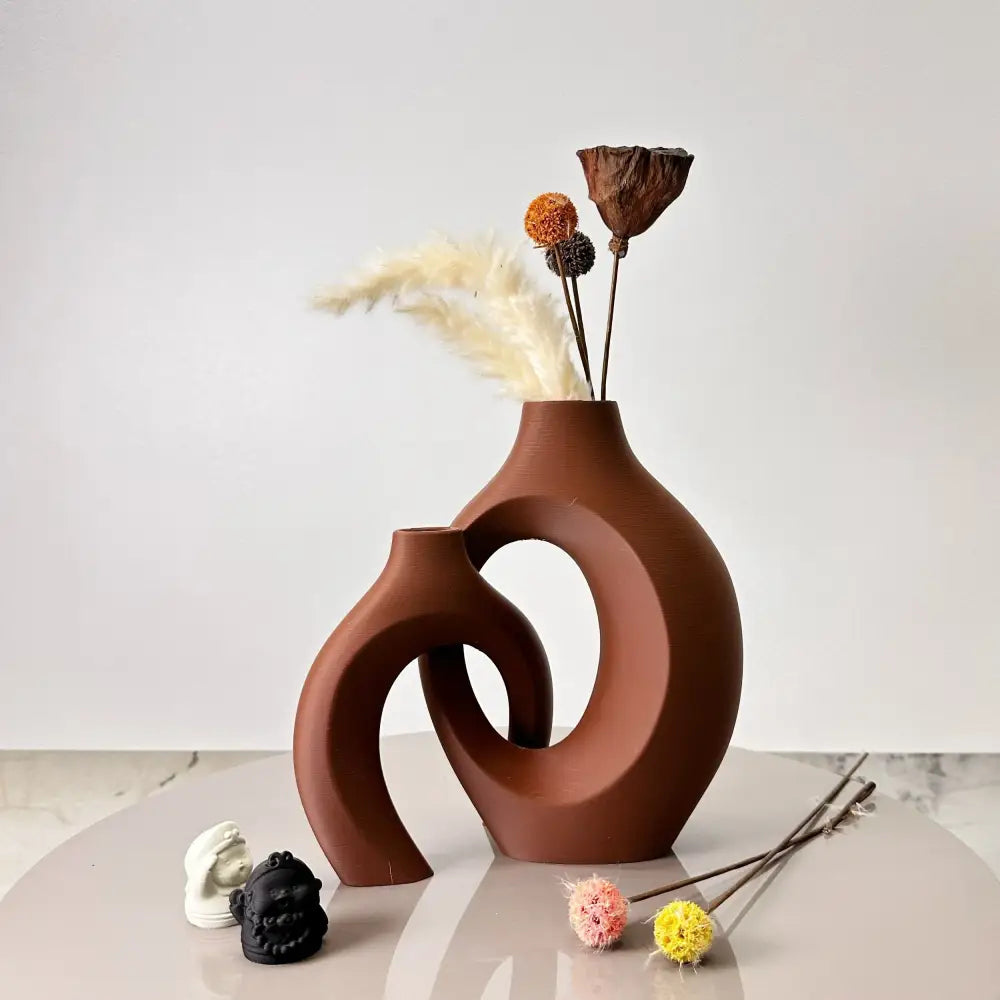 Terracotta-colored ceramic large dried vase with modern abstract interlocking curved forms from decorbites dried vase set