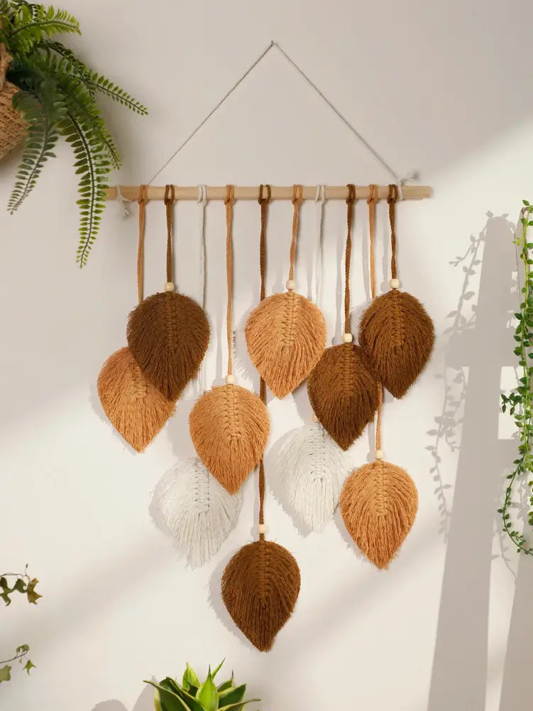 DecorBites™ rustic macrame wall hanging with brown and white woven leaf design suspended from wooden dowel