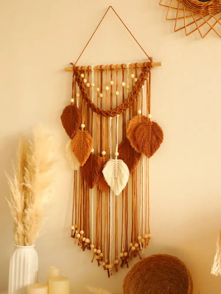 Decorbites™ leaf macrame wall hanging with woven leaves in brown and cream tones accented by wooden beads for boho decor