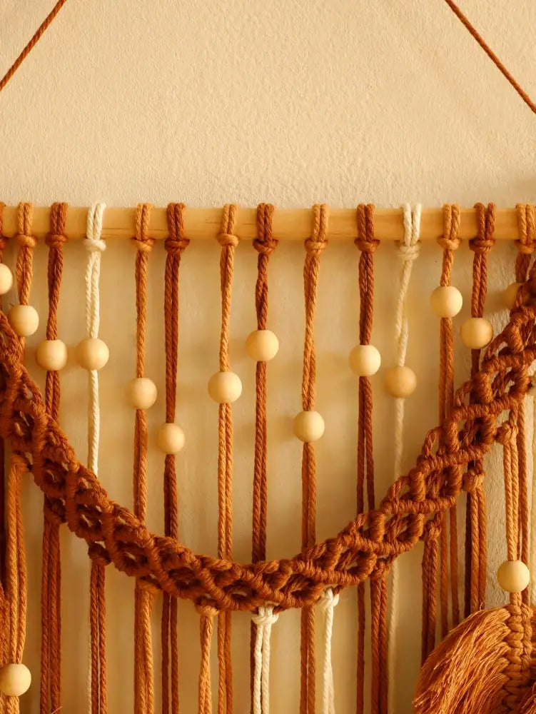 DecorBites™ leaf macrame wall hanging with warm brown and cream cords, wooden beads, and braided arch design for boho decor