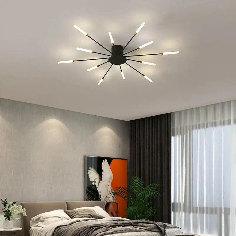 Modern black DecorBites™ LED ceiling chandelier light with slender arms and glowing white LED bulbs in Nordic design