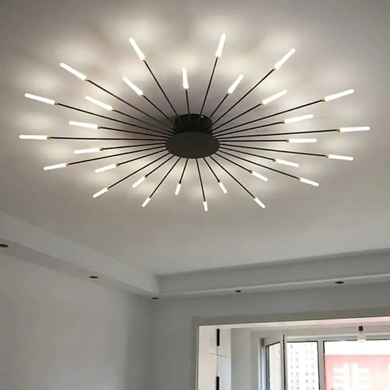 Modern black metal DecorBites™ LED ceiling chandelier light with multiple glowing white LED rods in Nordic design
