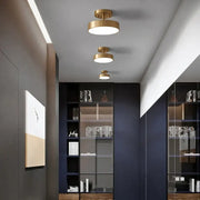 DecorBites™ led ceiling light featuring three modern gold-toned circular lights with a minimalist design for bedroom use
