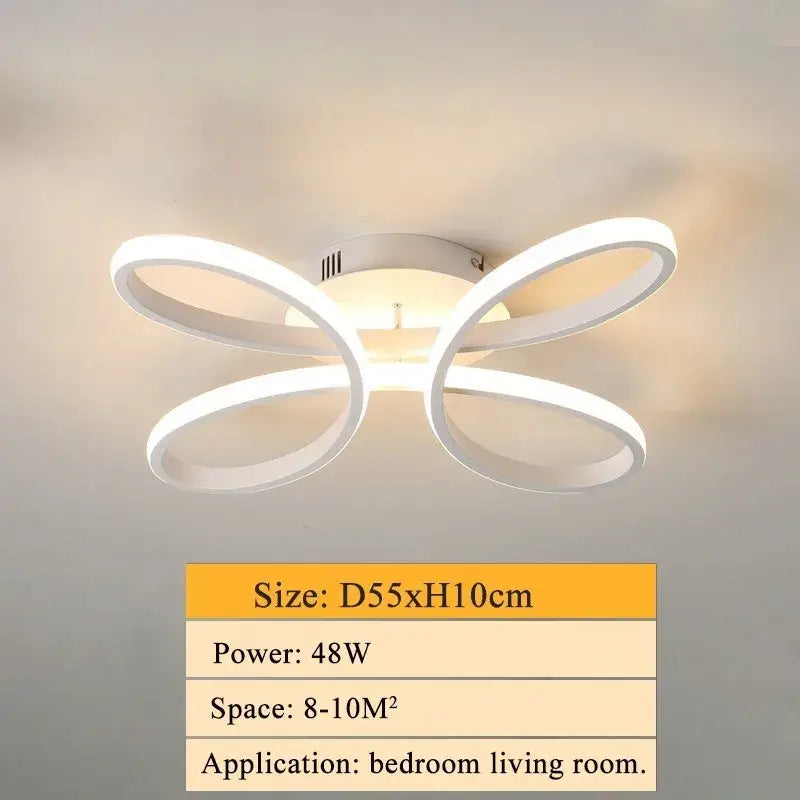 Modern white decorbites led ceiling light with sleek butterfly-shaped design and four curved rings for living room use
