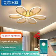 Gold-toned decorbites led ceiling light with flower-like design featuring five interconnected rings for living room use