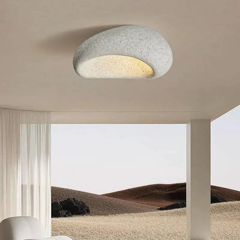 Modern oval-shaped decorbites led ceiling light with textured gray stone finish and warm glow for indoor decor