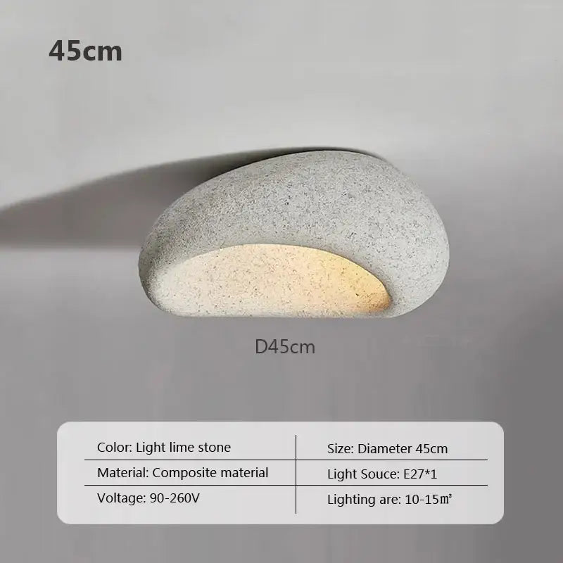 A sleek oval wall-mounted decorbites led ceiling light in light limestone composite for indoor home decor