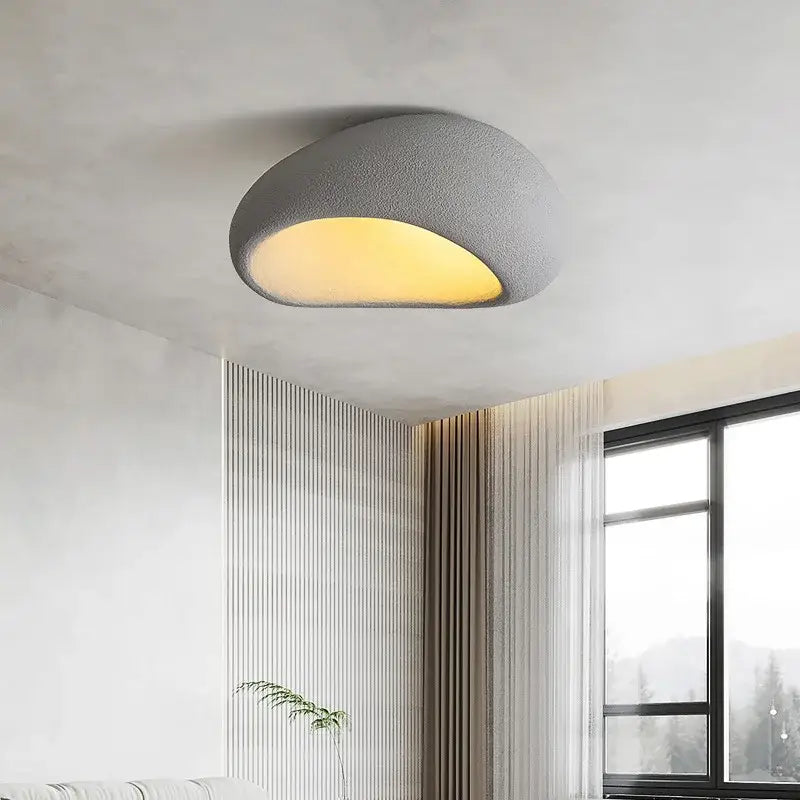 A modern gray textured DecorBites led ceiling light with warm yellow glow for bedroom and living room decor