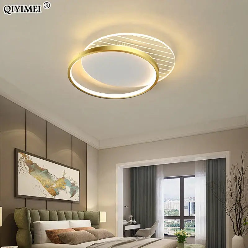 Gold-toned decorbites led ceiling light with modern circular design featuring inner ring illumination and outer decorative slats