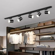 Black cylindrical decorbites led ceiling lights mounted on a ceiling rail for nordic home indoor lighting