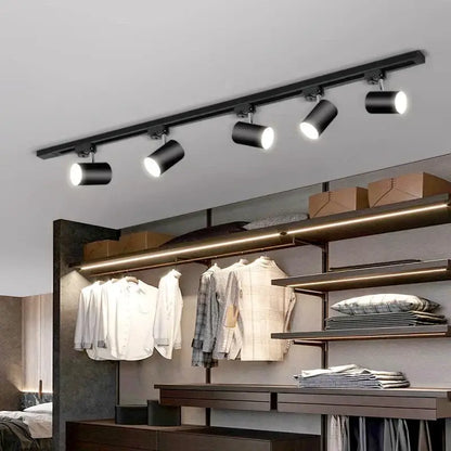 Black cylindrical decorbites led ceiling lights mounted on a ceiling rail for nordic home indoor lighting
