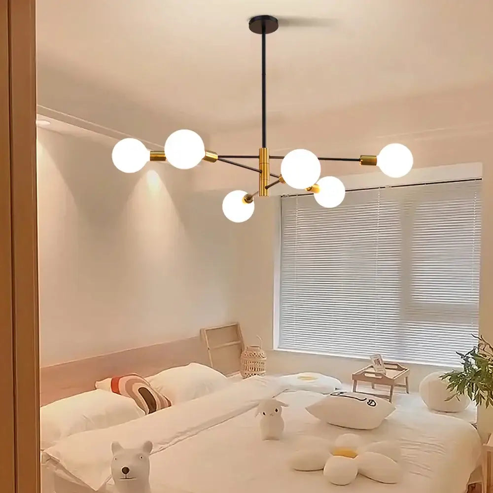Modern chandelier with six frosted glass globe bulbs on black rod and gold arms decorbites led ceiling lights minimalist design