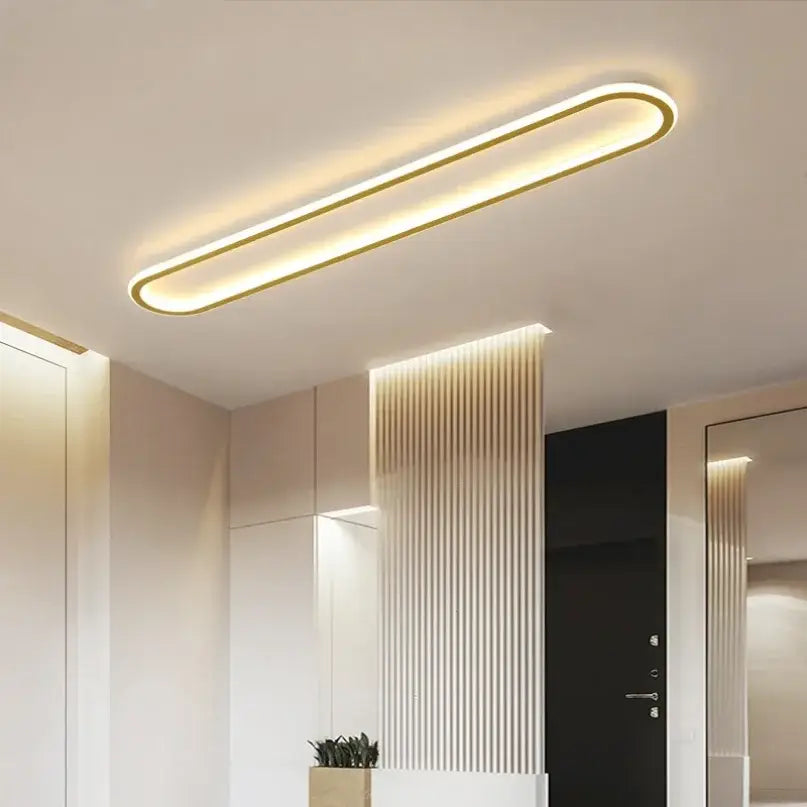 Modern gold-trimmed decorbites led ceiling light with sleek oval design emitting warm ambient illumination for home lighting