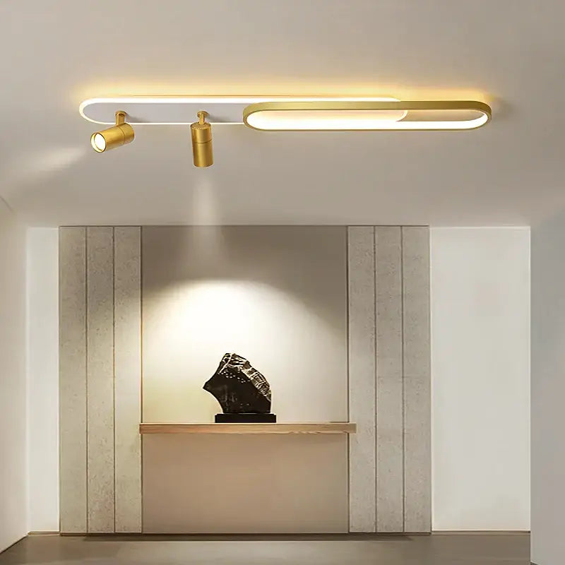 Modern gold-finished decorbites led ceiling light with integrated led strip and two adjustable spotlights for indoor use