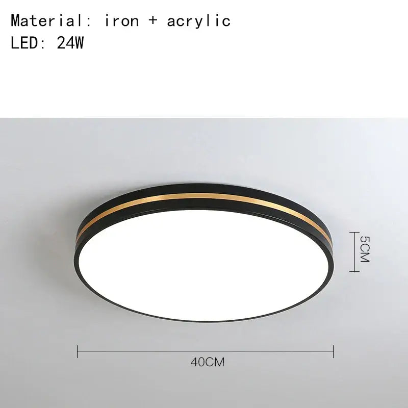 Modern round DecorBites LED ceiling light with black metal frame, gold trim, and white acrylic diffuser for minimalist decor