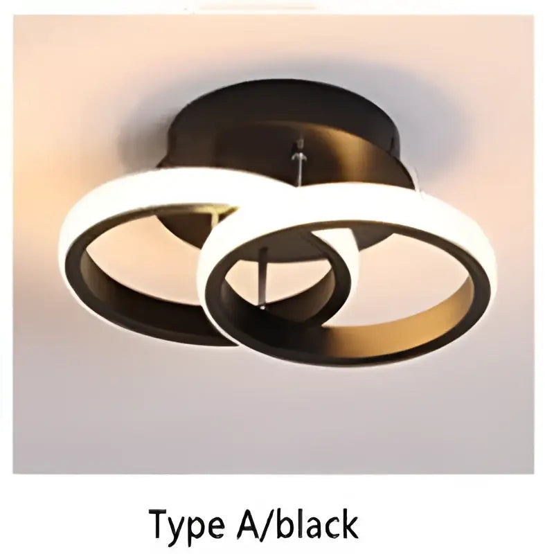 Black circular decorbites led ceiling light with three interlocking rings for modern bedroom and living room lighting
