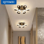 Modern gold-toned decorbites led ceiling lights with sleek intertwined loop design for living room and bedroom illumination