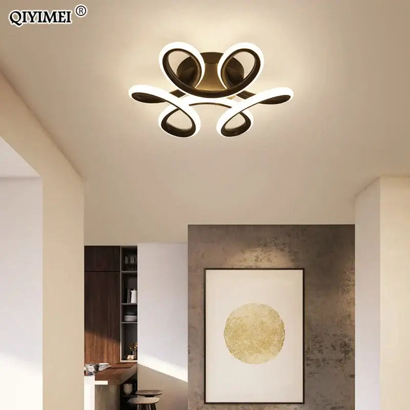 Modern gold and white DecorBites LED ceiling light with sleek swirling design for living room bedroom and balcony illumination