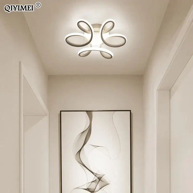 Modern white decorbites led ceiling lights with polished metal flower-like design for living room and bedroom illumination