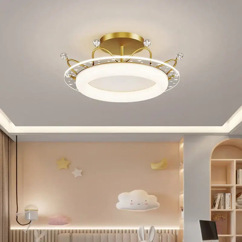 Gold-toned decorbites led ceiling light with circular design crystal accents and star-patterned trim for indoor use