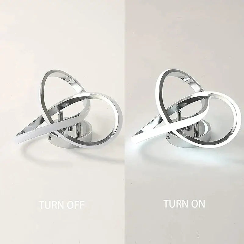 Modern chrome finished decorbites led ceiling wall sconce with intertwined ring design glowing softly for living rooms