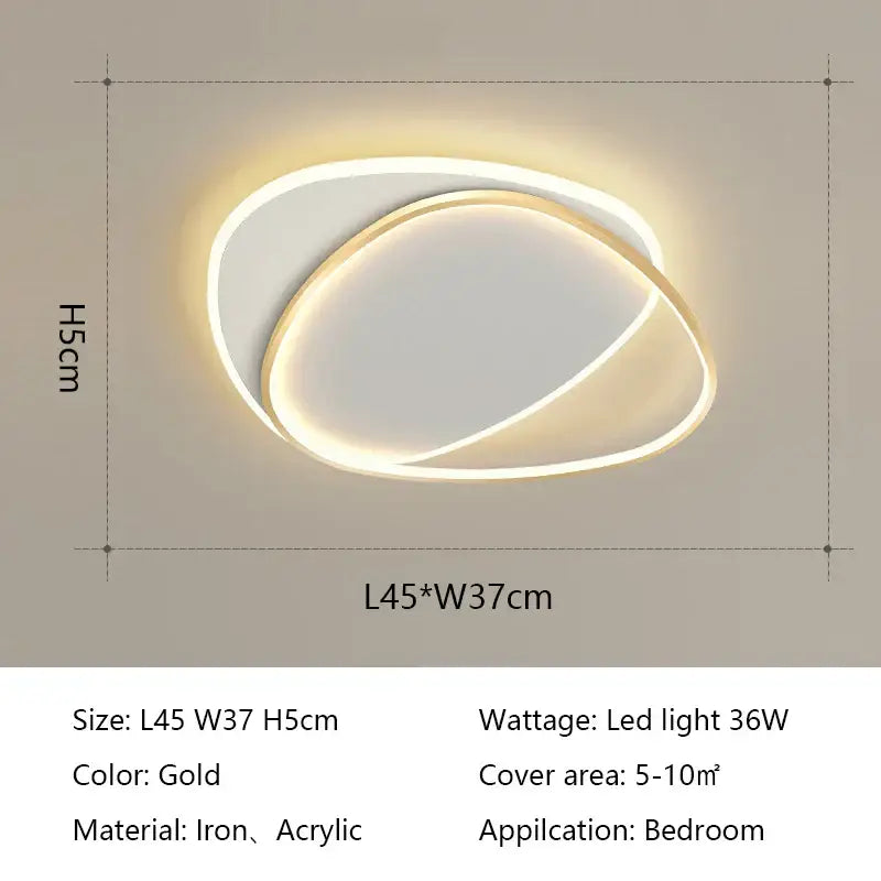 Gold-colored decorbites led ceiling light with two interlocking iron and acrylic oval rings for bedroom use