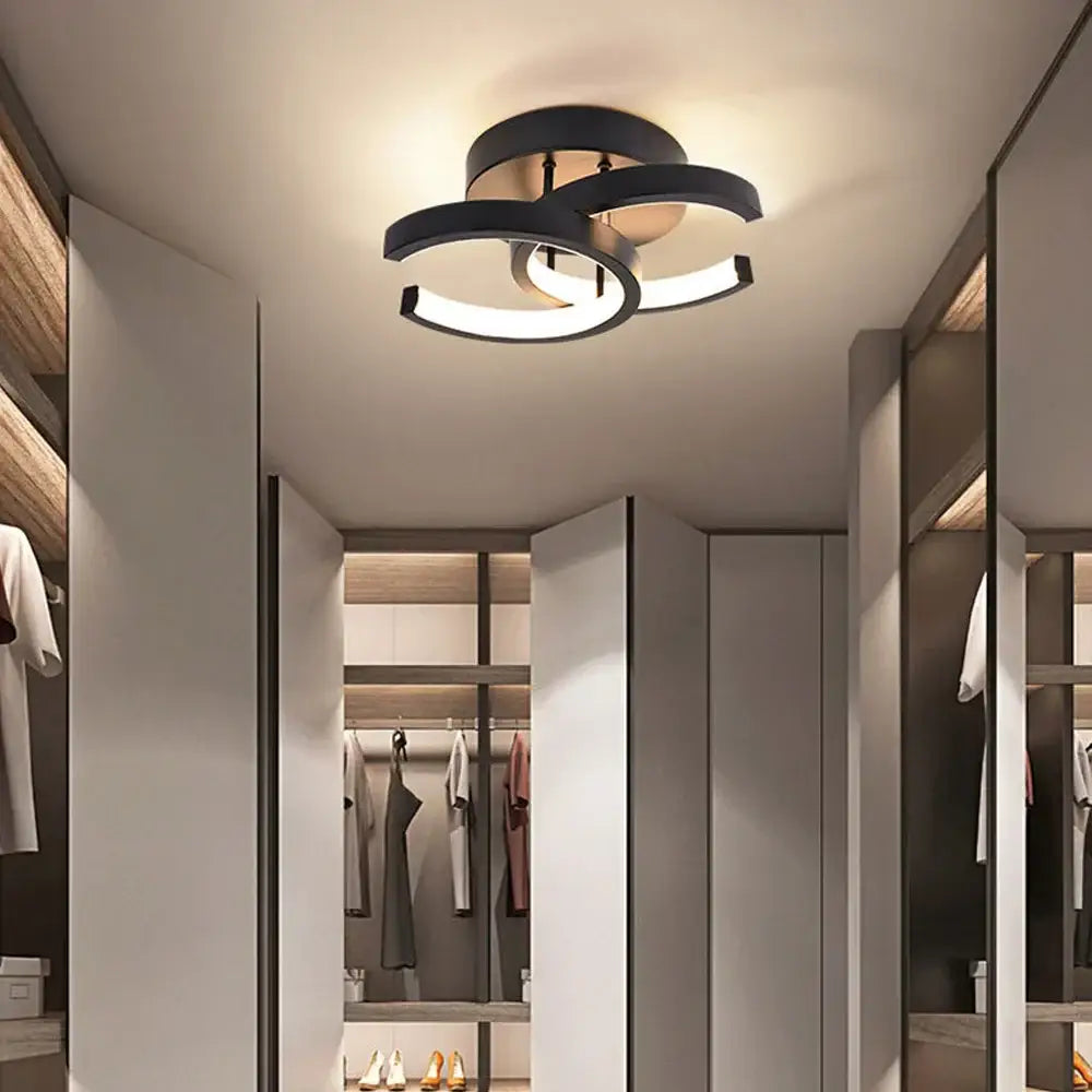 Modern black circular DecorBites LED ceiling lights with sleek overlapping rings and warm glow for living room lighting
