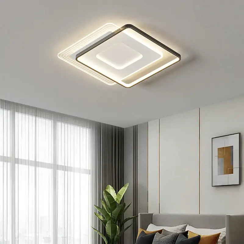 Modern DecorBites led ceiling light with sleek black frame and layered white LED panels emitting warm ambient glow