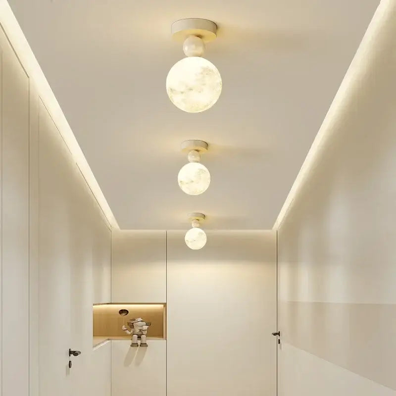 DecorBites led ceiling moon lamp with three frosted white spherical lights featuring marble-like veining for bedroom use