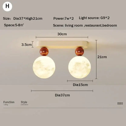 Cream-colored DecorBites LED ceiling moon wall lamp with two spherical moon bulbs and amber decorative spheres
