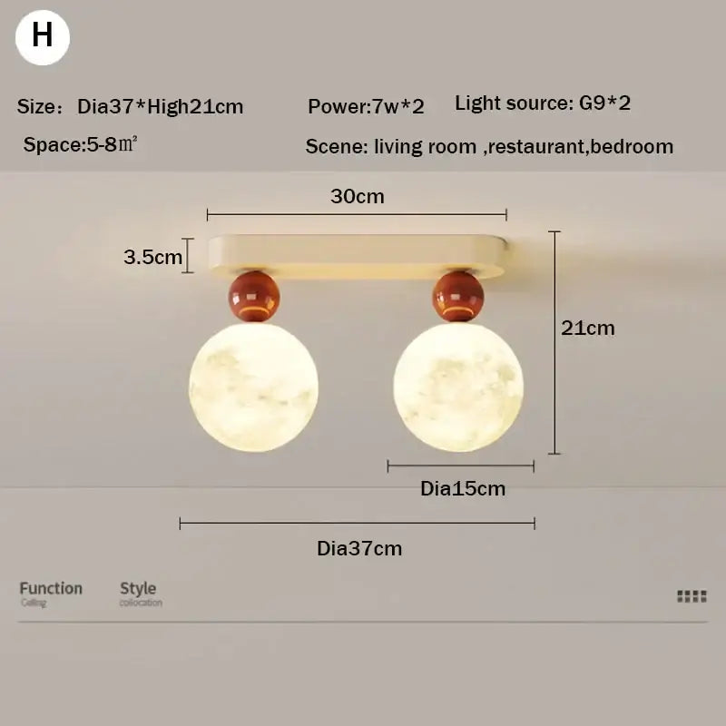Cream-colored DecorBites LED ceiling moon wall lamp with two spherical moon bulbs and amber decorative spheres