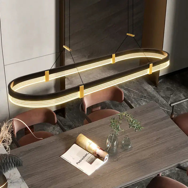 Modern oval-shaped led ceiling pendant from decorbites with warm yellow light black frame and gold supports for living room decor