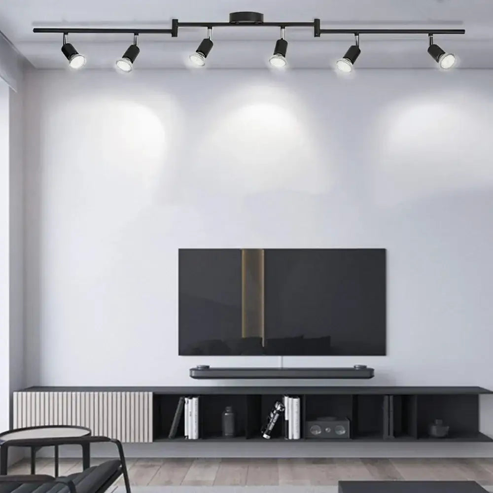 Black decorbites™ led ceiling spotlight chandelier with five adjustable spotlights mounted above a television