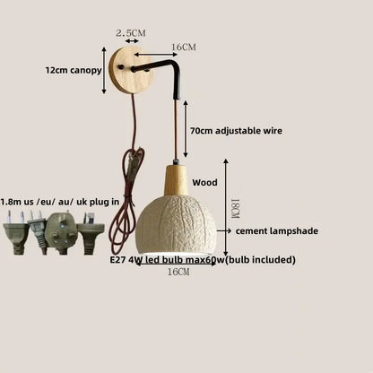A rustic decorbites led cement wall light with off-white cement shade, wooden canopy, and adjustable black wire stem