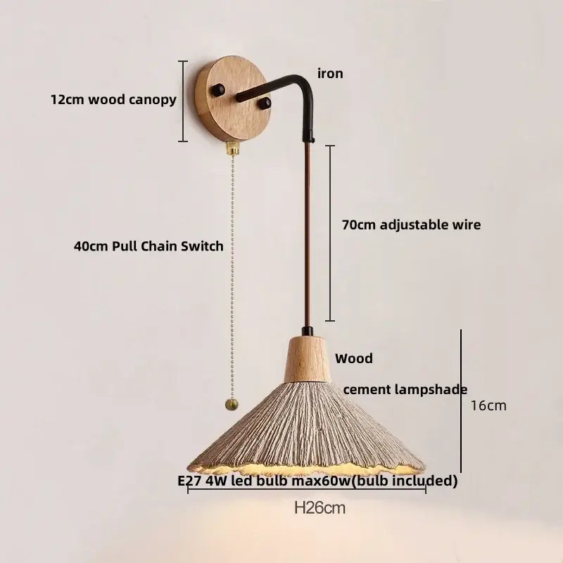 A rustic decorbites led cement wall light with black iron arm, wooden canopy, and adjustable wire with conical shade