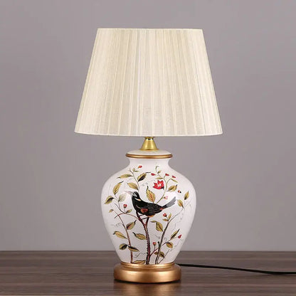 Decorbites led ceramic table lamp with white base, hand-painted black bird and floral design, off-white pleated shade