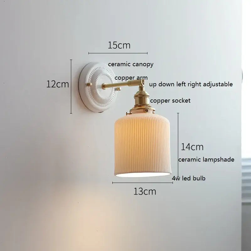 Cream-colored ribbed ceramic decorbites led ceramic wall lamp with copper arm and white ceramic canopy for bedroom bathroom mirror
