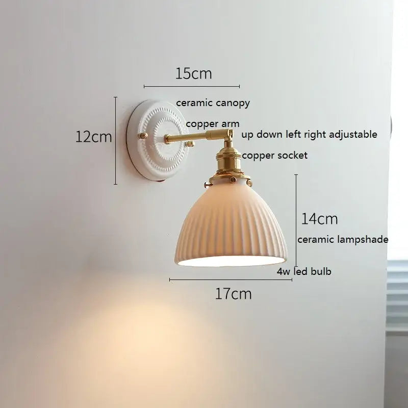 Cream-colored decorbites led ceramic wall lamp with vertical ridges and copper arm for bedroom and bathroom mirror