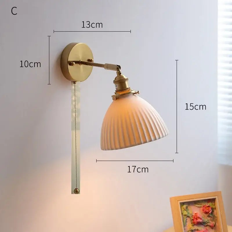 Vintage-style decorbites led ceramic wall sconce with brass finish ribbed off-white ceramic shade and pull-chain switch