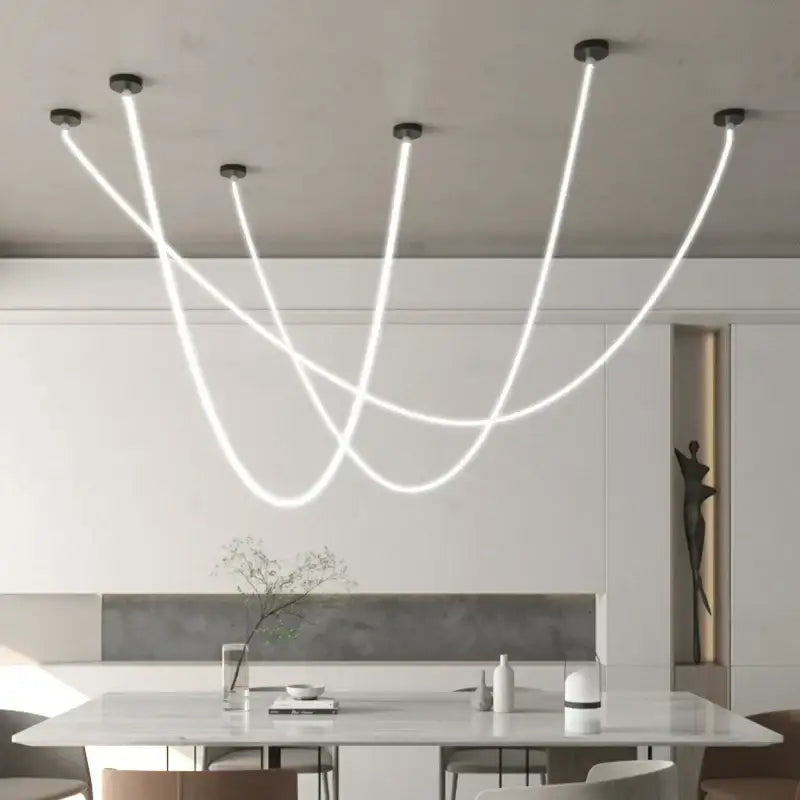 Modern white DecorBites LED chandelier pendant light with sleek curved silicone strands and black ceiling mounts for interiors