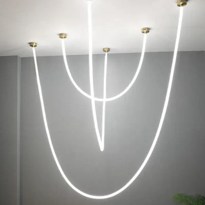 Modern white DecorBites LED chandelier pendant light with curved glowing lines and brass ceiling mounts for versatile decor