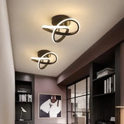 Modern black and white LED chandelier black with sleek intertwined ring design by DecorBites LED chandelier