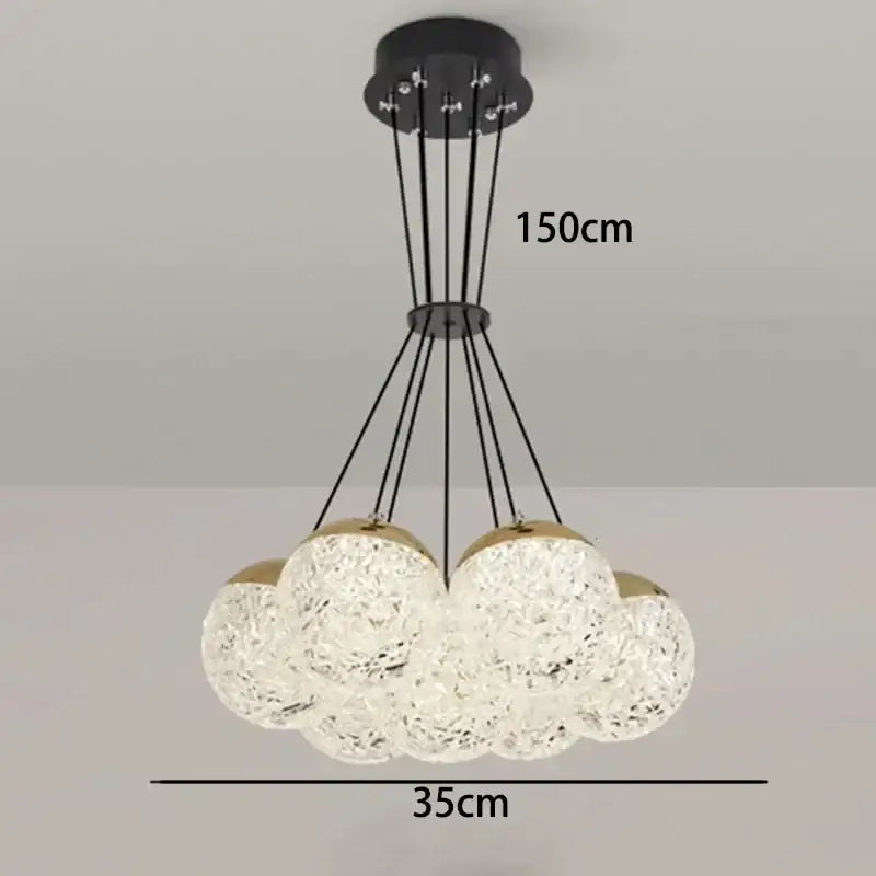 Modern decorbites led chandelier ceiling lamp with clear textured glass spheres and gold accents for chic bedroom lighting