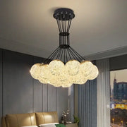 Decorbites led chandelier with glowing crystal spheres and black metal frame as chandelier ceiling lamp for chic lighting