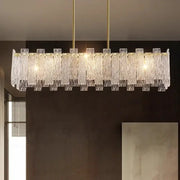 Decorbites led chandelier ceiling lamp with clear textured glass panels and gold metal rods for living room and bedroom lighting